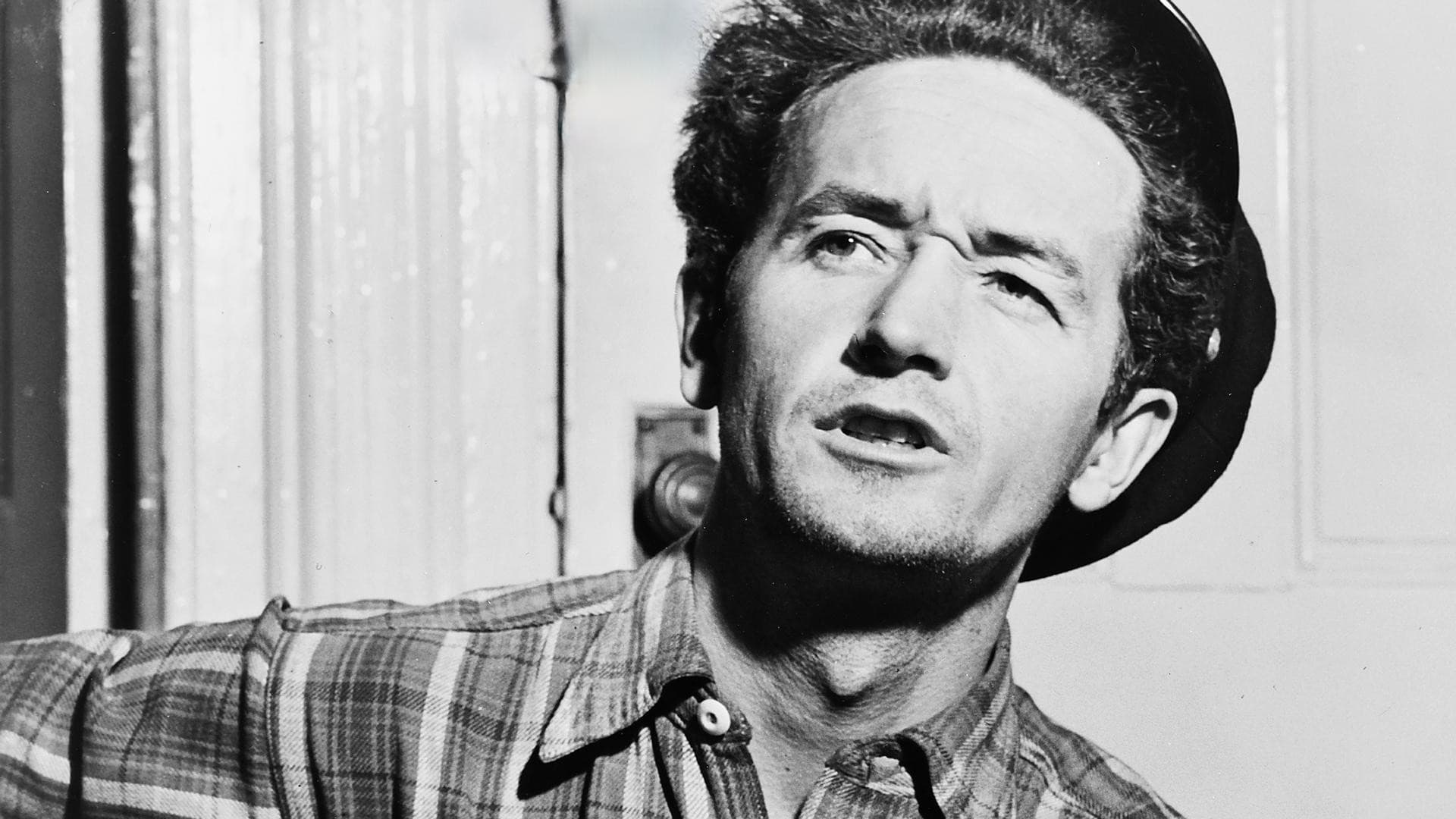 Woody Guthrie and the Ghost of Tom Joad Today backdrop