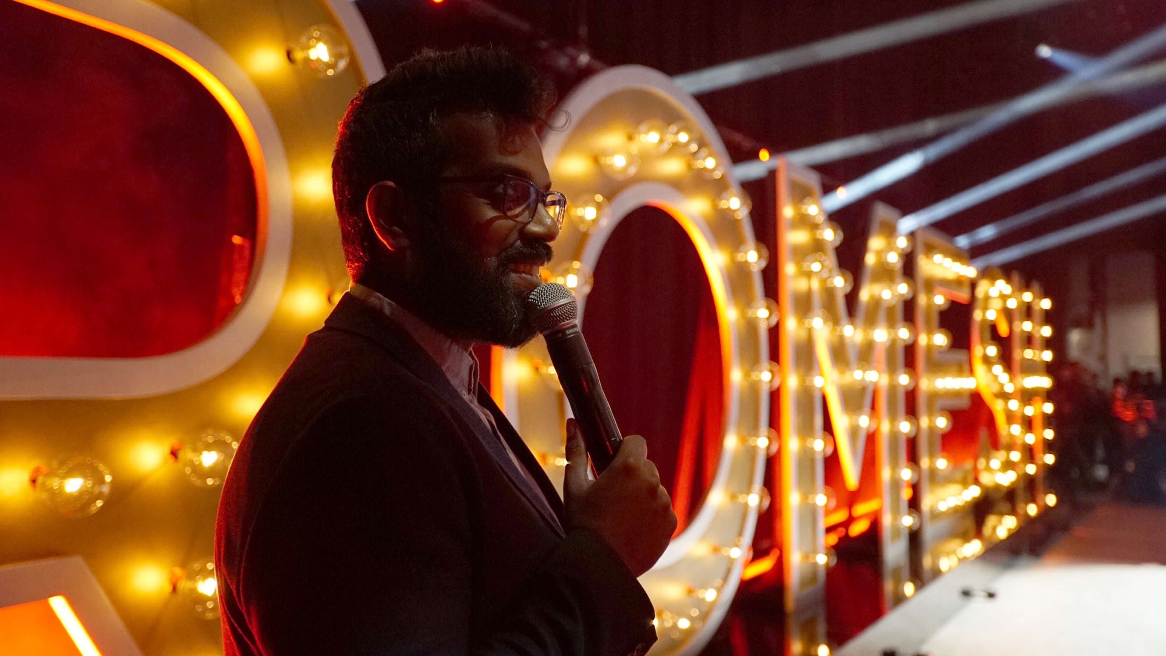 Just Another Immigrant: Romesh at the Greek backdrop